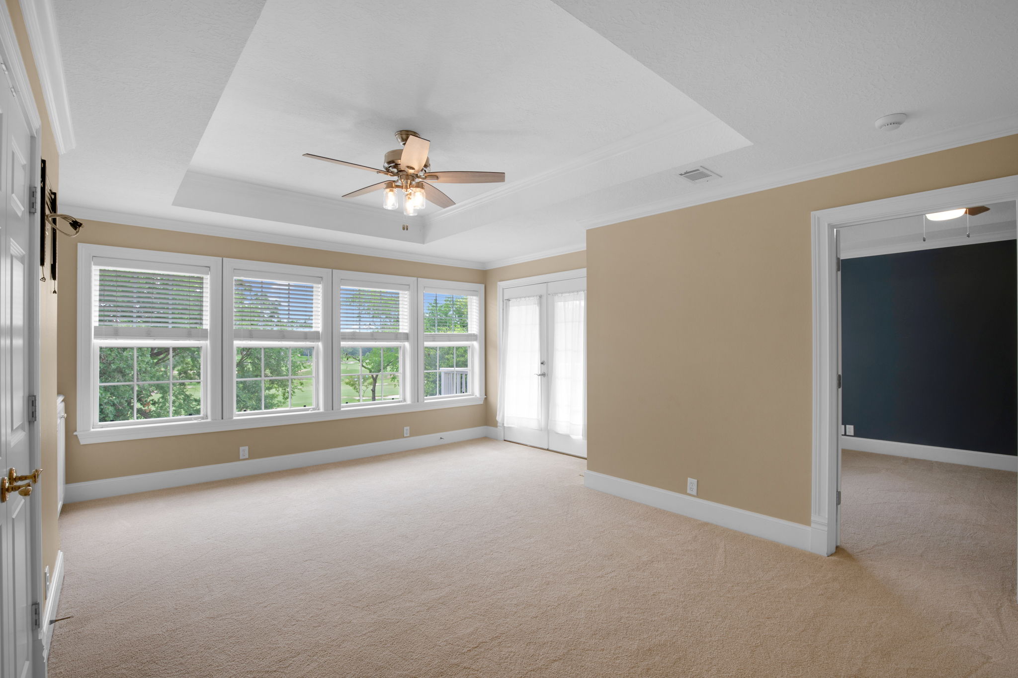 Second floor living room with balcony access