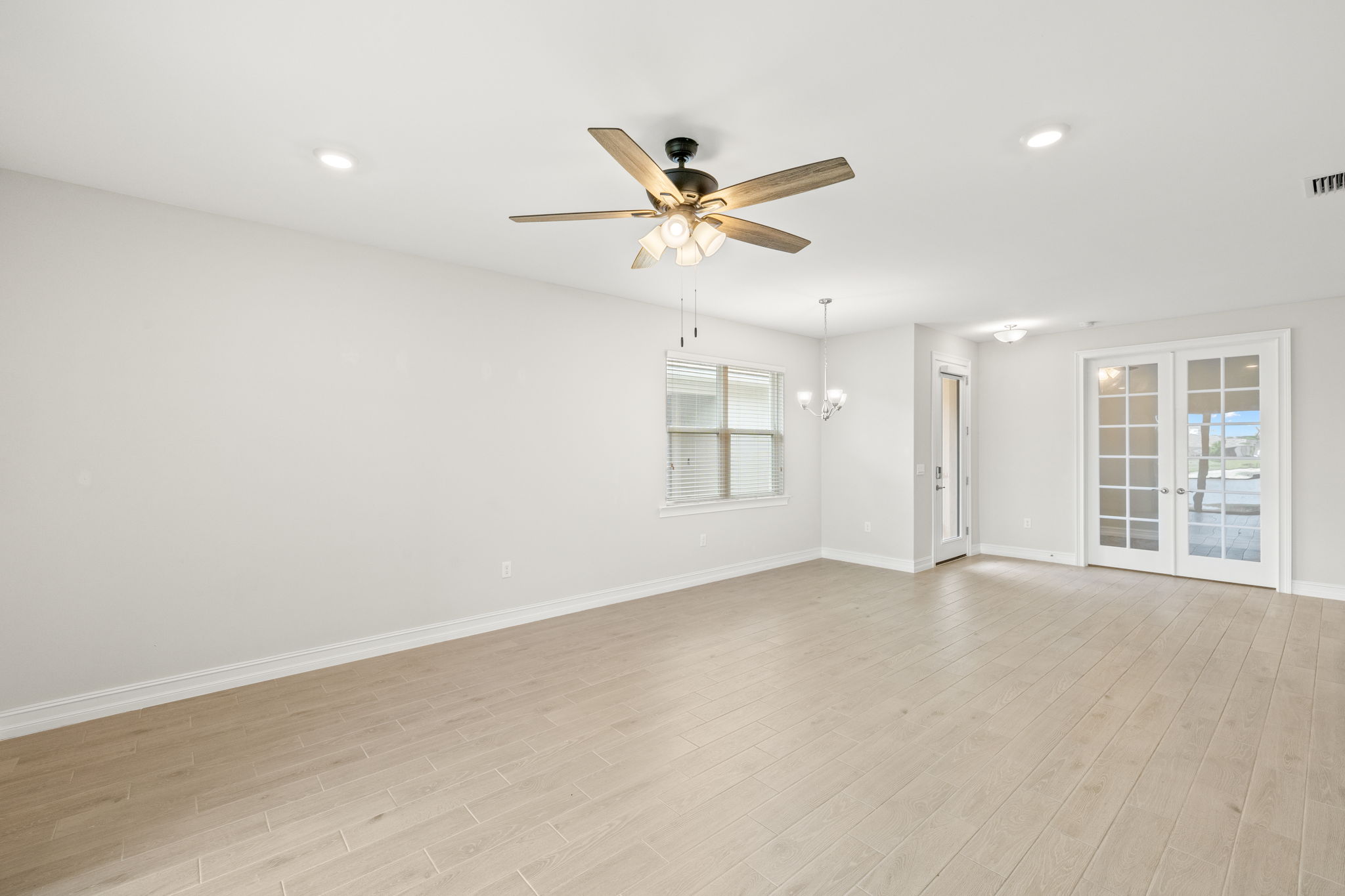 Living Room +Den with French Doors