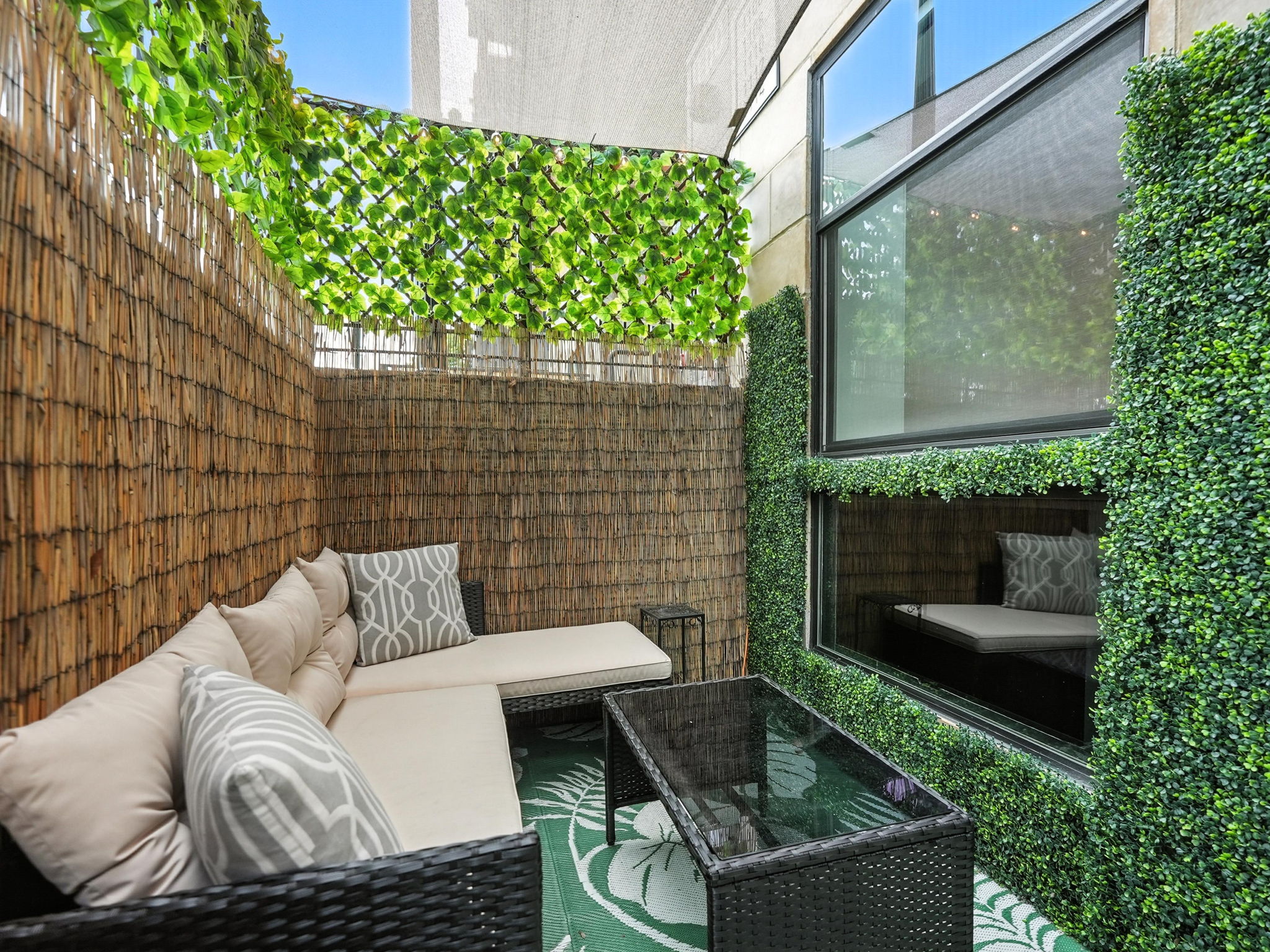 String lights, shad sail, & decorative greenery. Makes your own oasis.