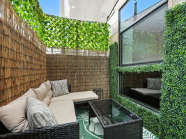 String lights, shad sail, & decorative greenery. Makes your own oasis.