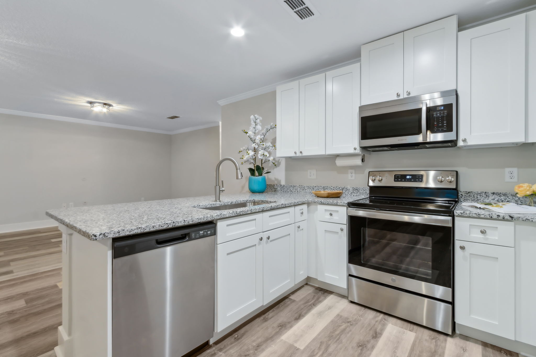 ...and all wood, soft-close white shaker cabinets.