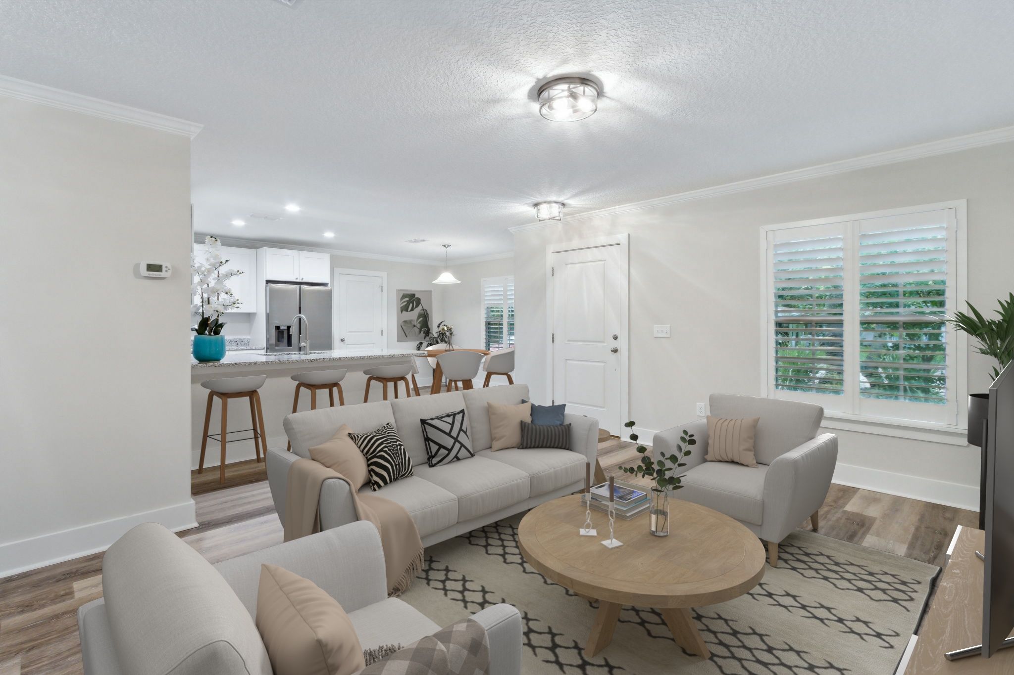 A flowing open plan links the family room, kitchen, and dining space.