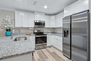 ... With granite counters, stainless steel appliances ...
