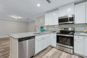...and all wood, soft-close white shaker cabinets.