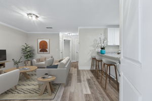 Luxury wood-look plank flooring extends throughout the home—zero carpet, all style. (Virtually Staged)