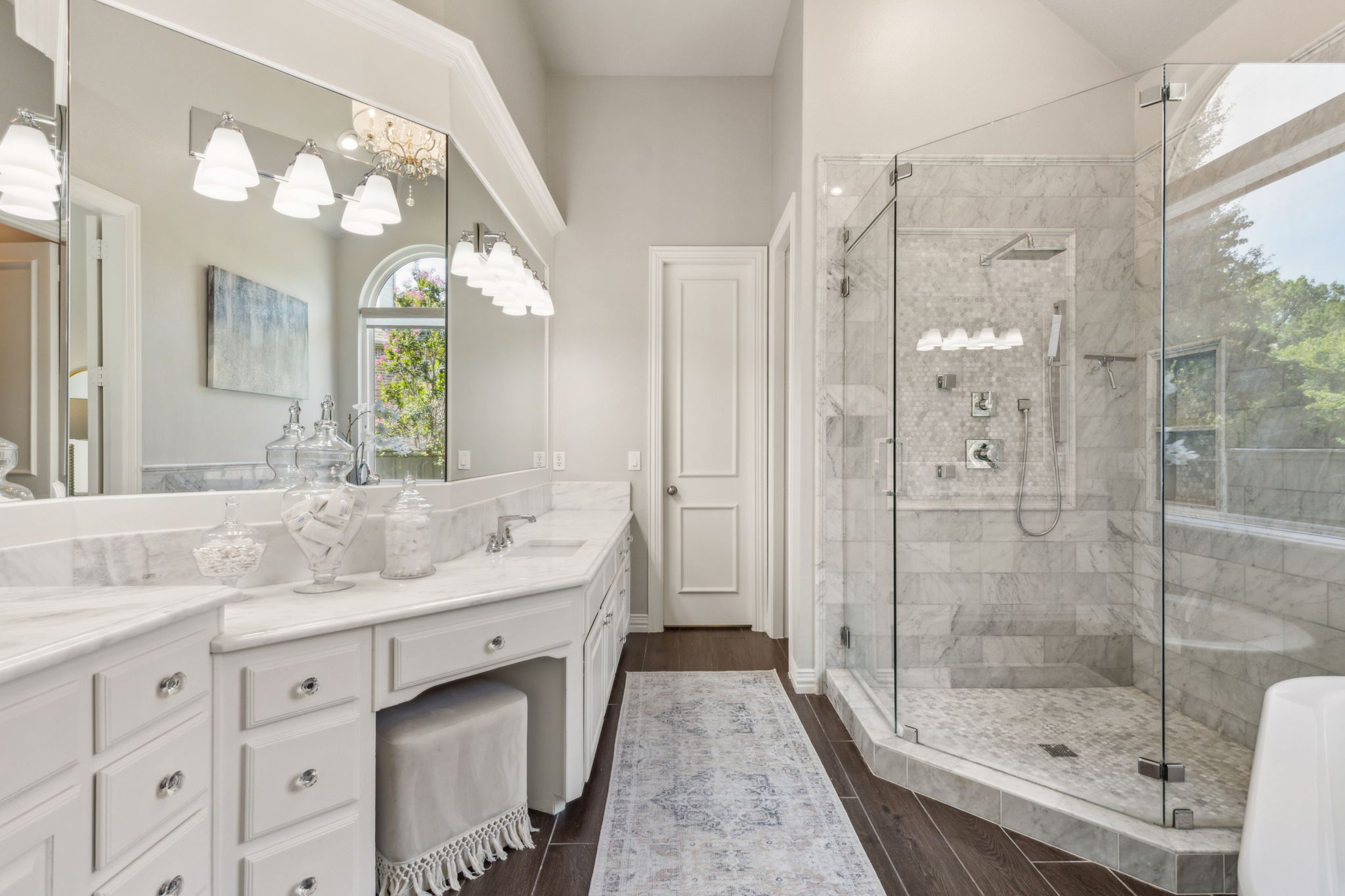 This breathtaking bathroom has been fully remodeled with meticulous attention to detail. It features a separate shower and tub, double sinks, and an abundance of storage.