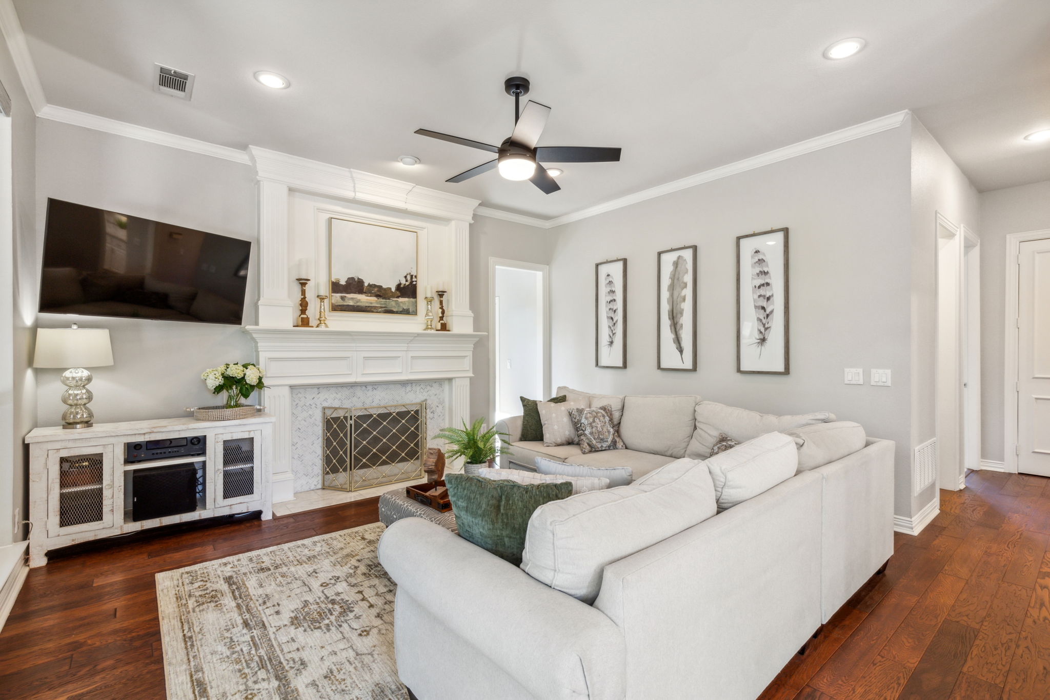 The gas fireplace adds a cozy touch to the beautiful living room.