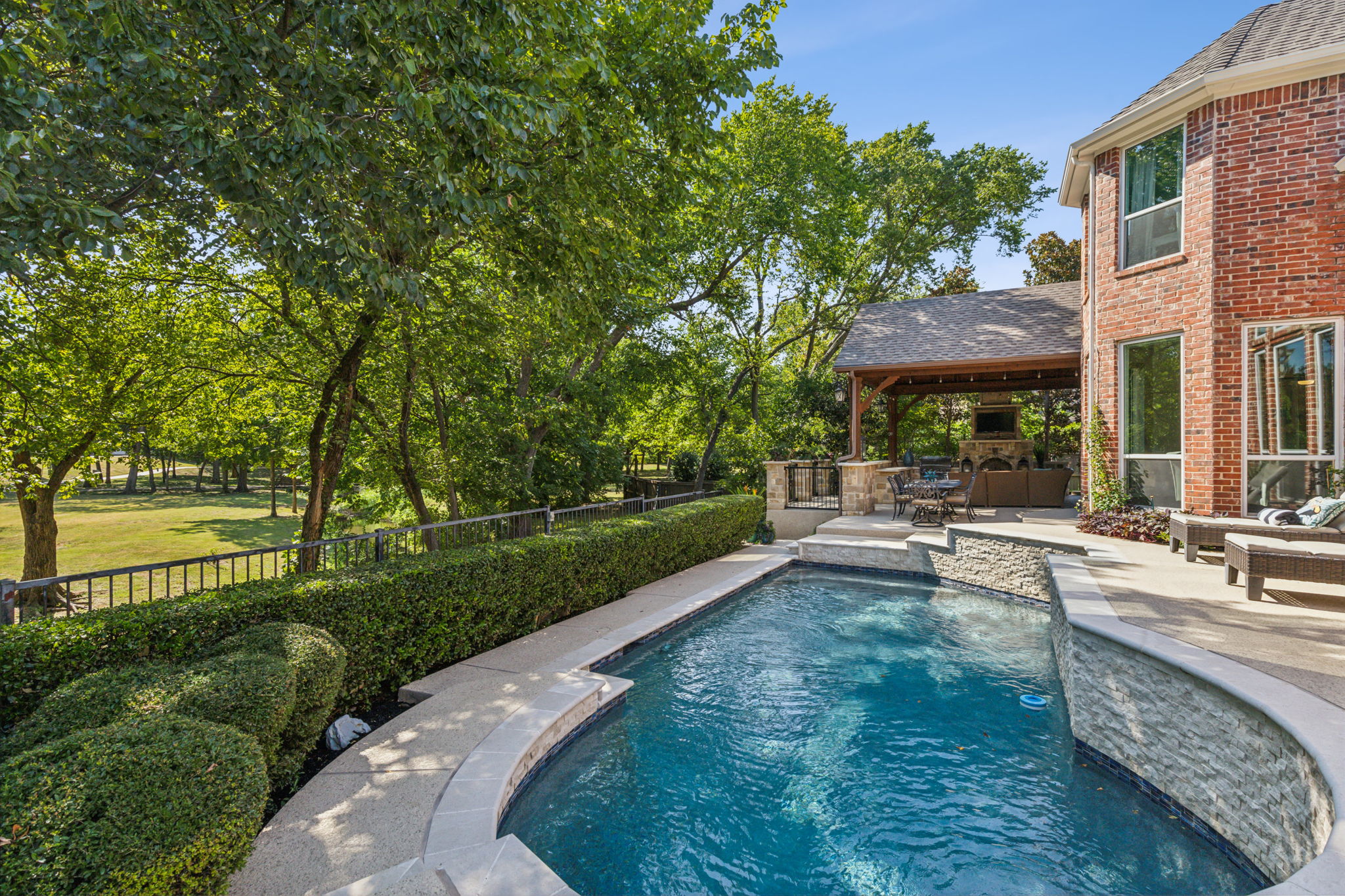 Picture yourself enjoying hours of relaxation in this fully renovated pool (2021), all while soaking in stunning greenbelt views.