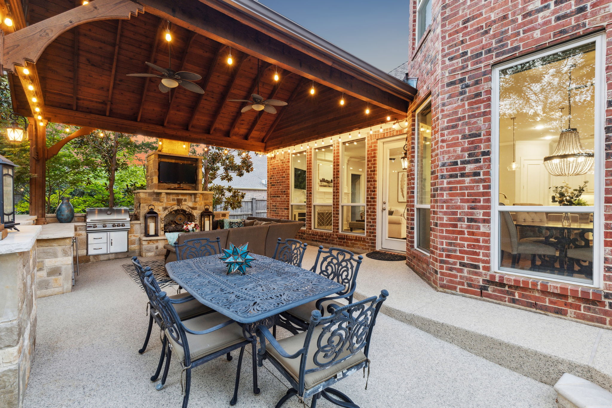 The outdoor living area includes several spaces for relaxation or dining, perfect for entertaining friends and family.