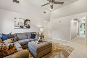 The game room features a vaulted ceiling, recessed lighting, newer carpet (2016), and a new ceiling fan (2024).