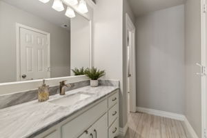 This beautifully updated bathroom, a Jack-and-Jill between bedrooms #3 and #4, features ample storage and a shower/tub combo (not shown).