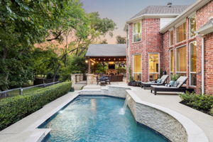 The outdoor living space and pool offer multiple spots to entertain friends and unwind.