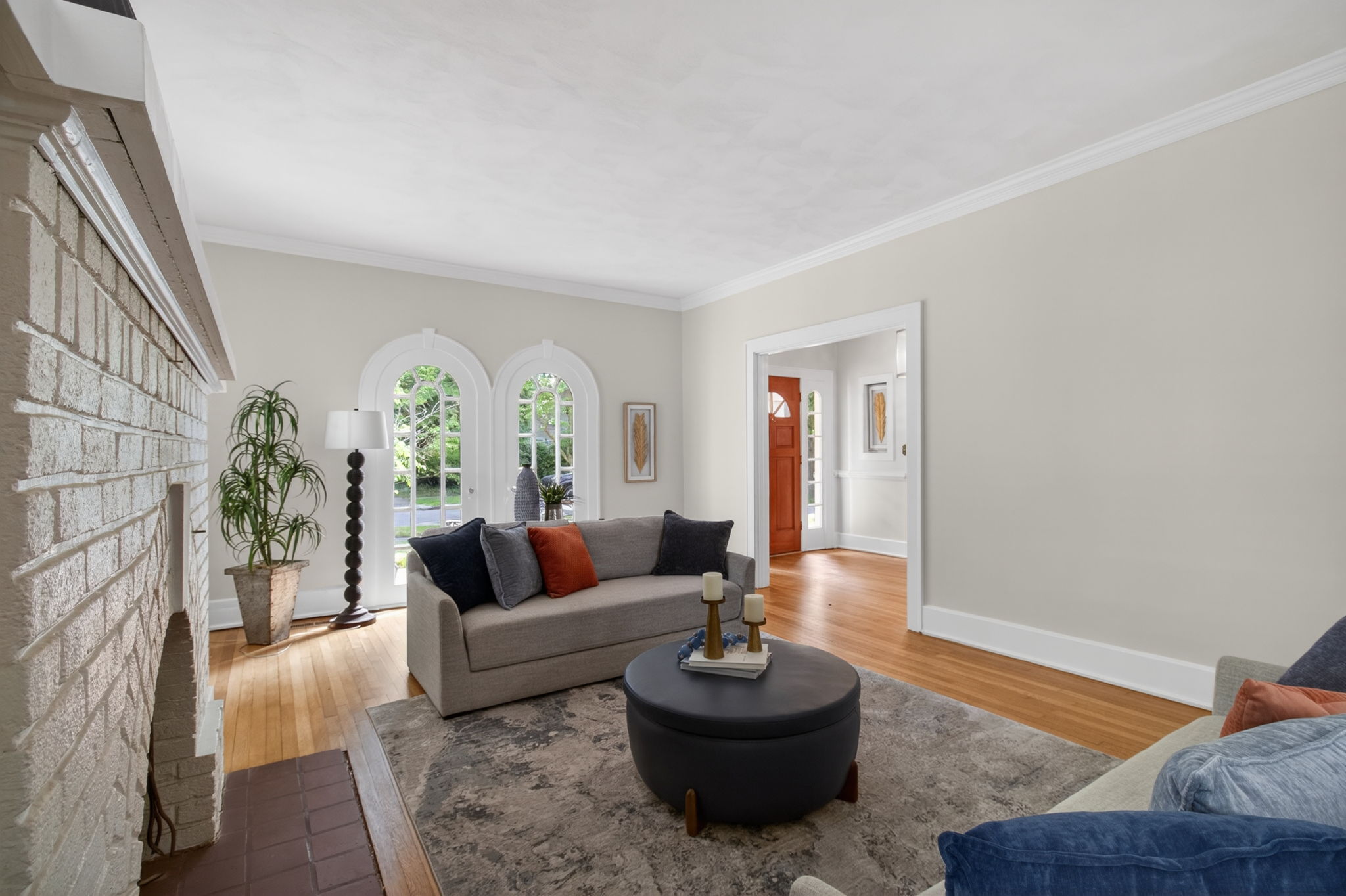 Large sun drenched living room with gas fireplace.
