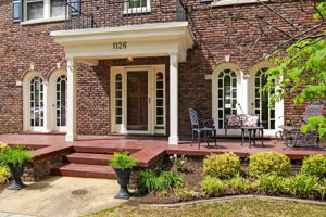 Fantastic front porch running the width of the home.