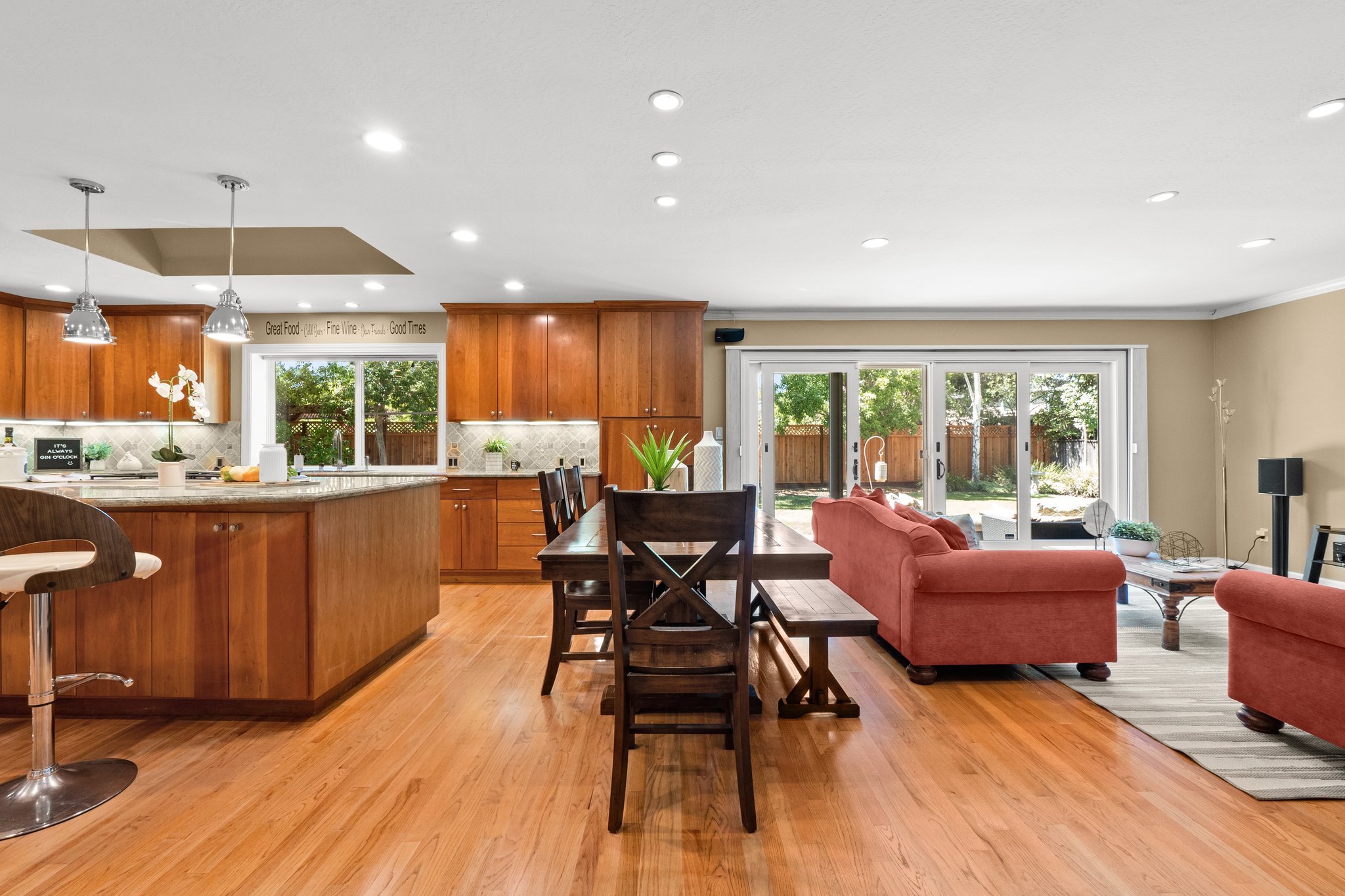 A living space seamlessly blending with an open kitchen and dining zone.