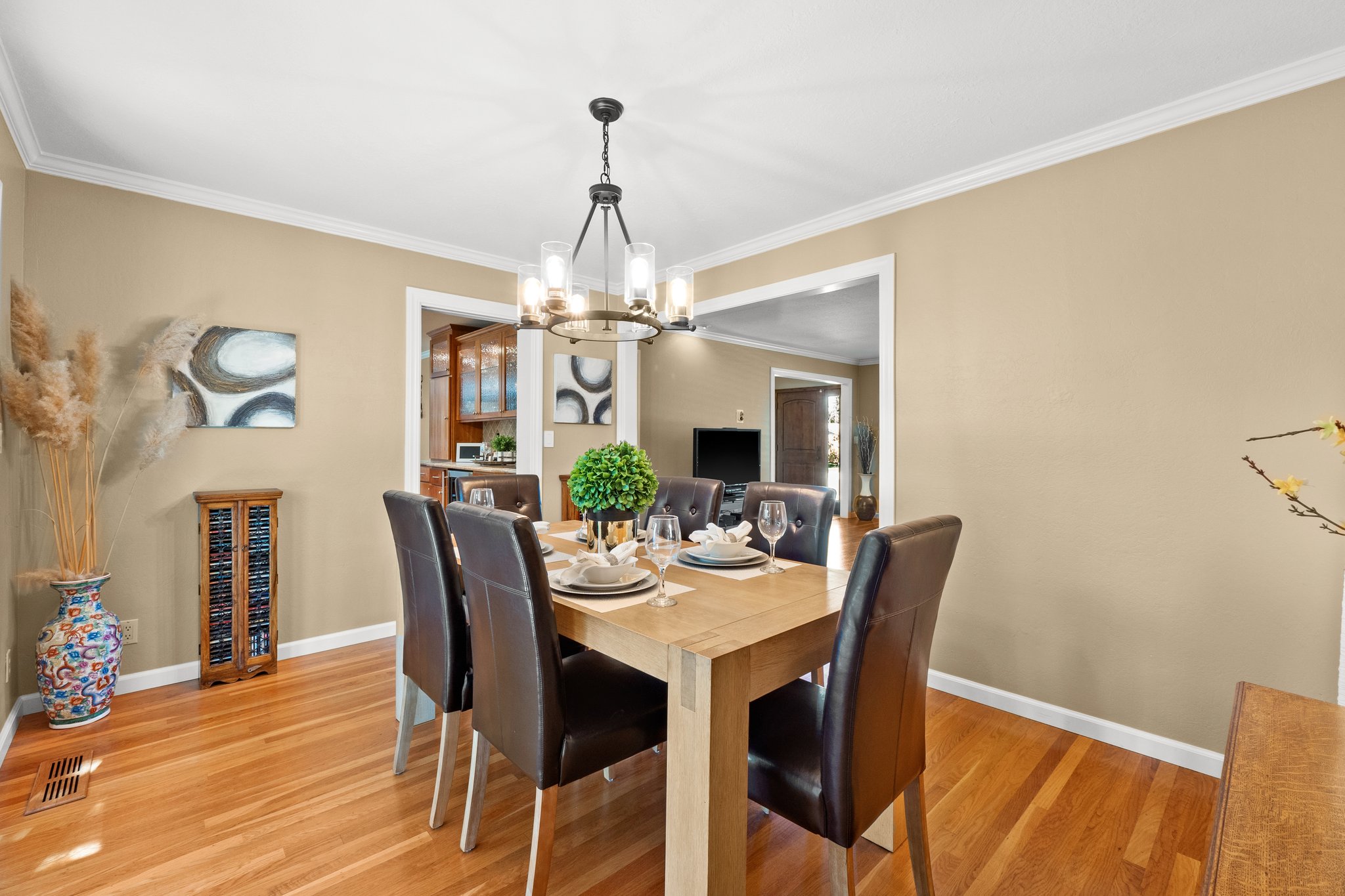 A stylish dining room with a wooden table and chair ensemble.