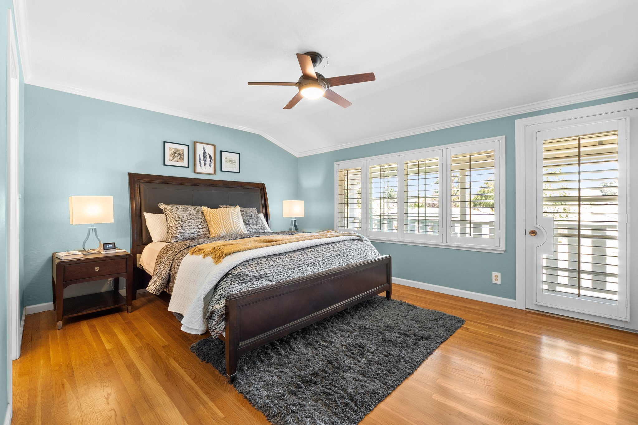 The Master bedroom, featuring an opulent bed and a ceiling fan for ultimate relaxation.