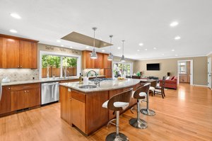 Kitchen with a large island and a sink.