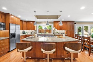 Kitchen boasting a spacious island.