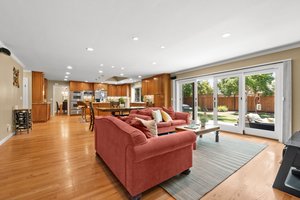An inviting lounge featuring a couch, TV, and a functional coffee table.
