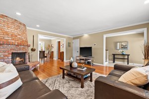 An inviting lounge with a fireplace and sofa.