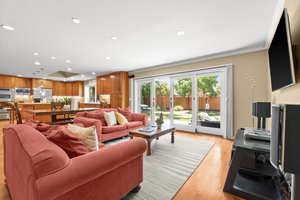 Relaxation haven in the form of a living room, complete with a soft couch and a comforting television.