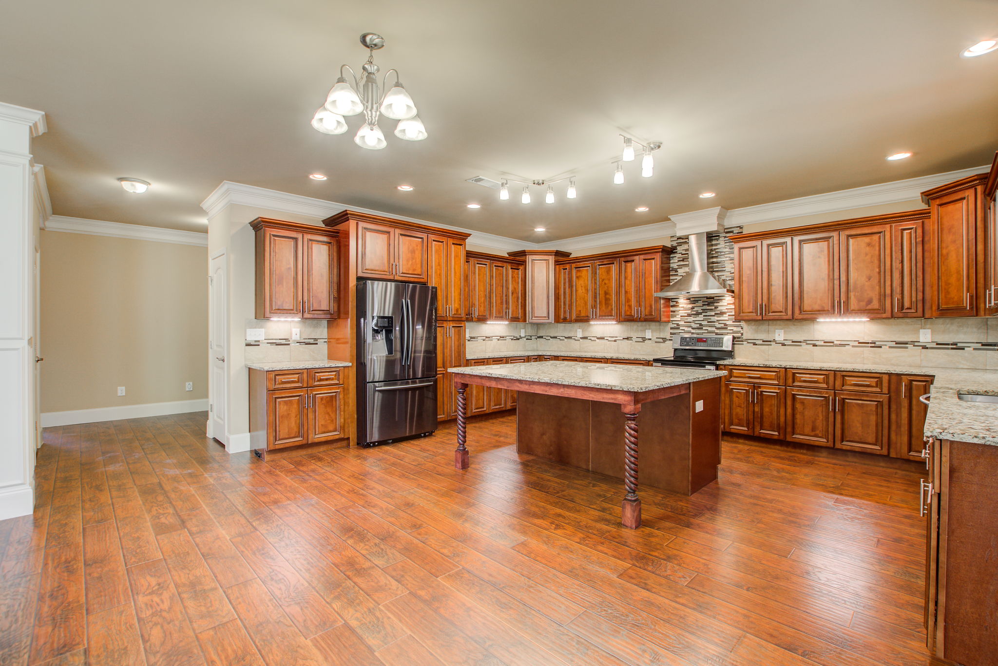 14 Kitchen D w Hallway to Dining + Laundry