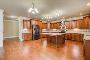 14 Kitchen D w Hallway to Dining + Laundry
