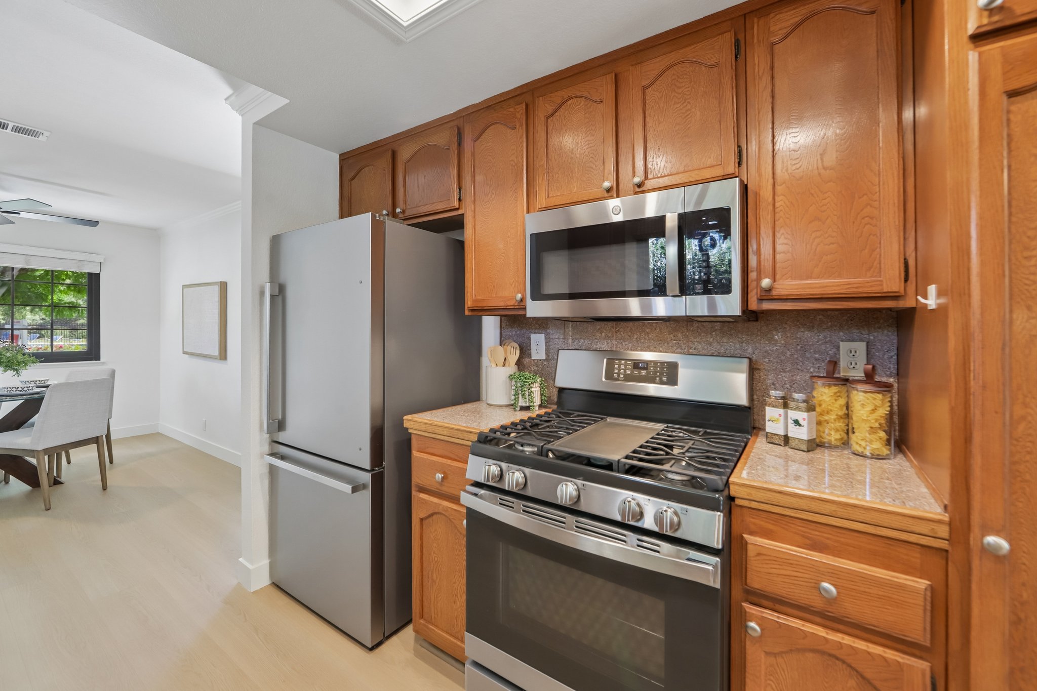 Kitchen w/ Gas stove and Refrigerator