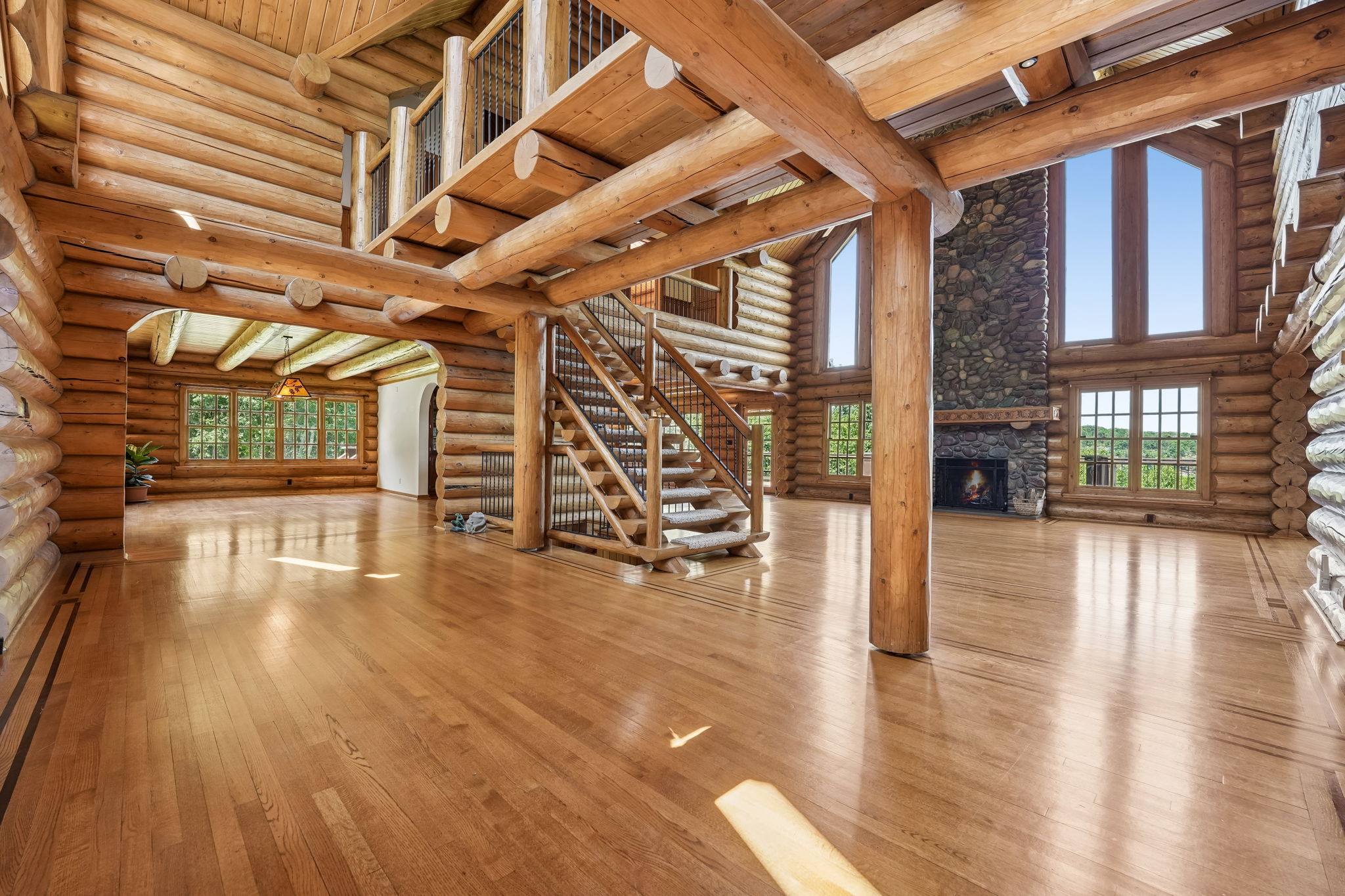 Foyer looking into Living Room with floor to ceiling windows