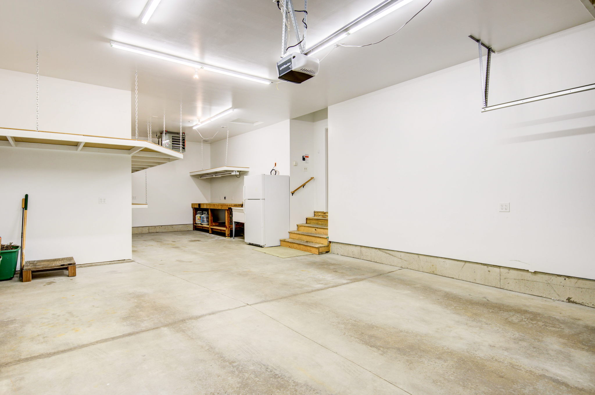 33 Heated Garage With Custom Shelving, 220v, Utility Sink With Hot & Cold Water and Refrigerator