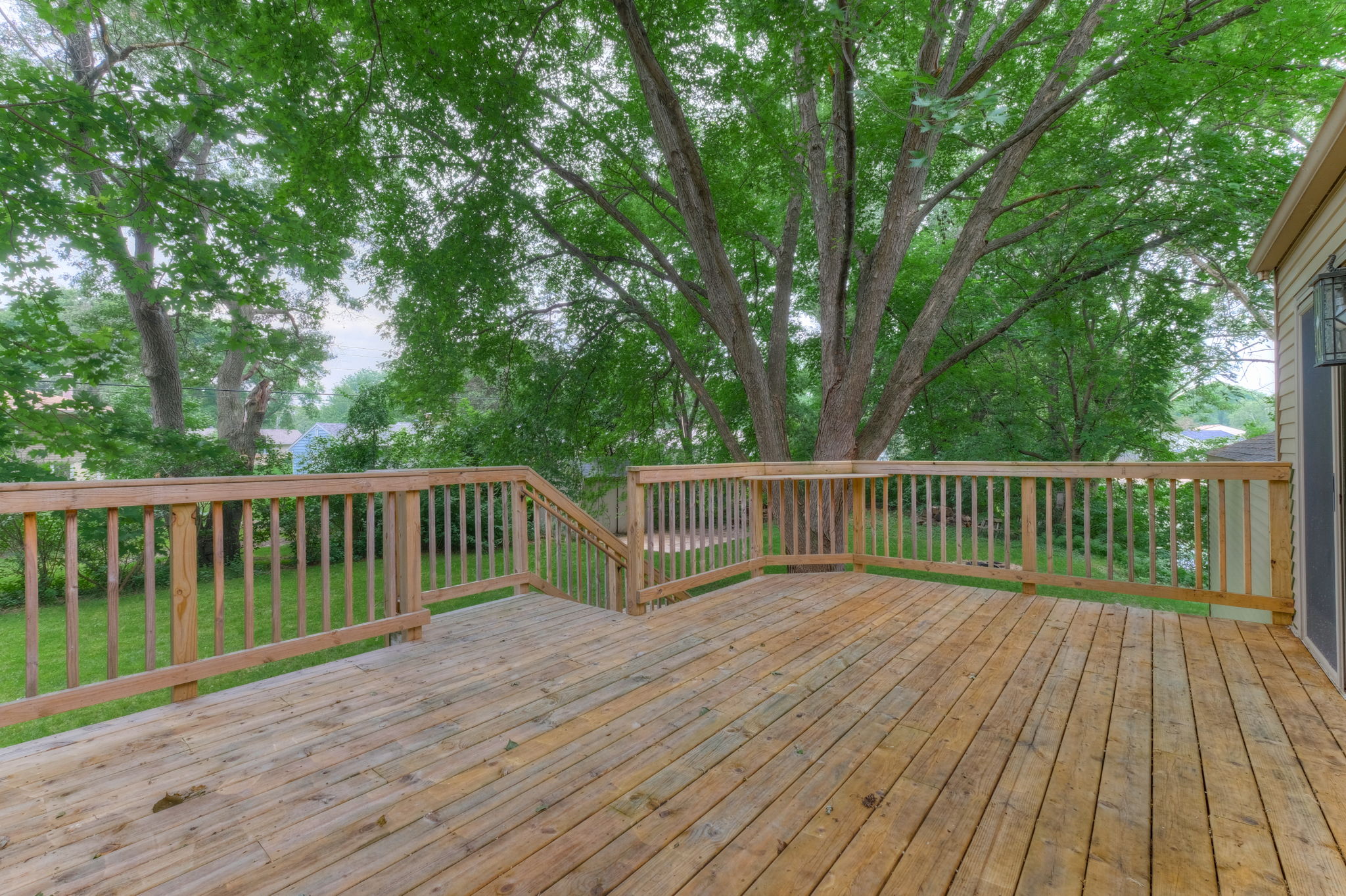 Very nice deck overlooking the large yard.