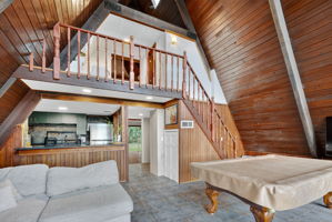 Living, Dining, and Kitchen with Stairway to Second Floor