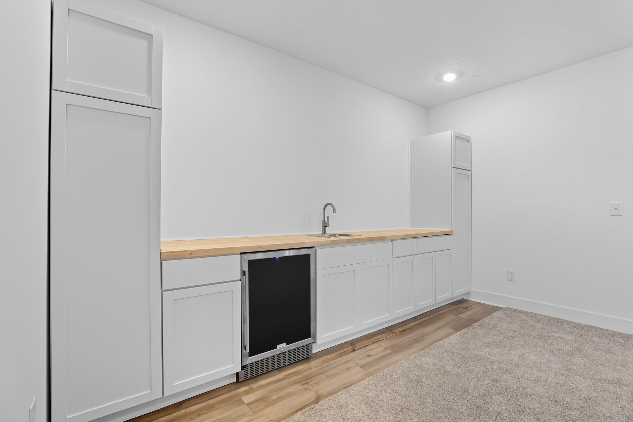Newly installed wet bar with wine fridge