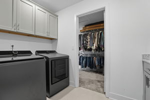Upstairs Laundry connects to Primary Closet