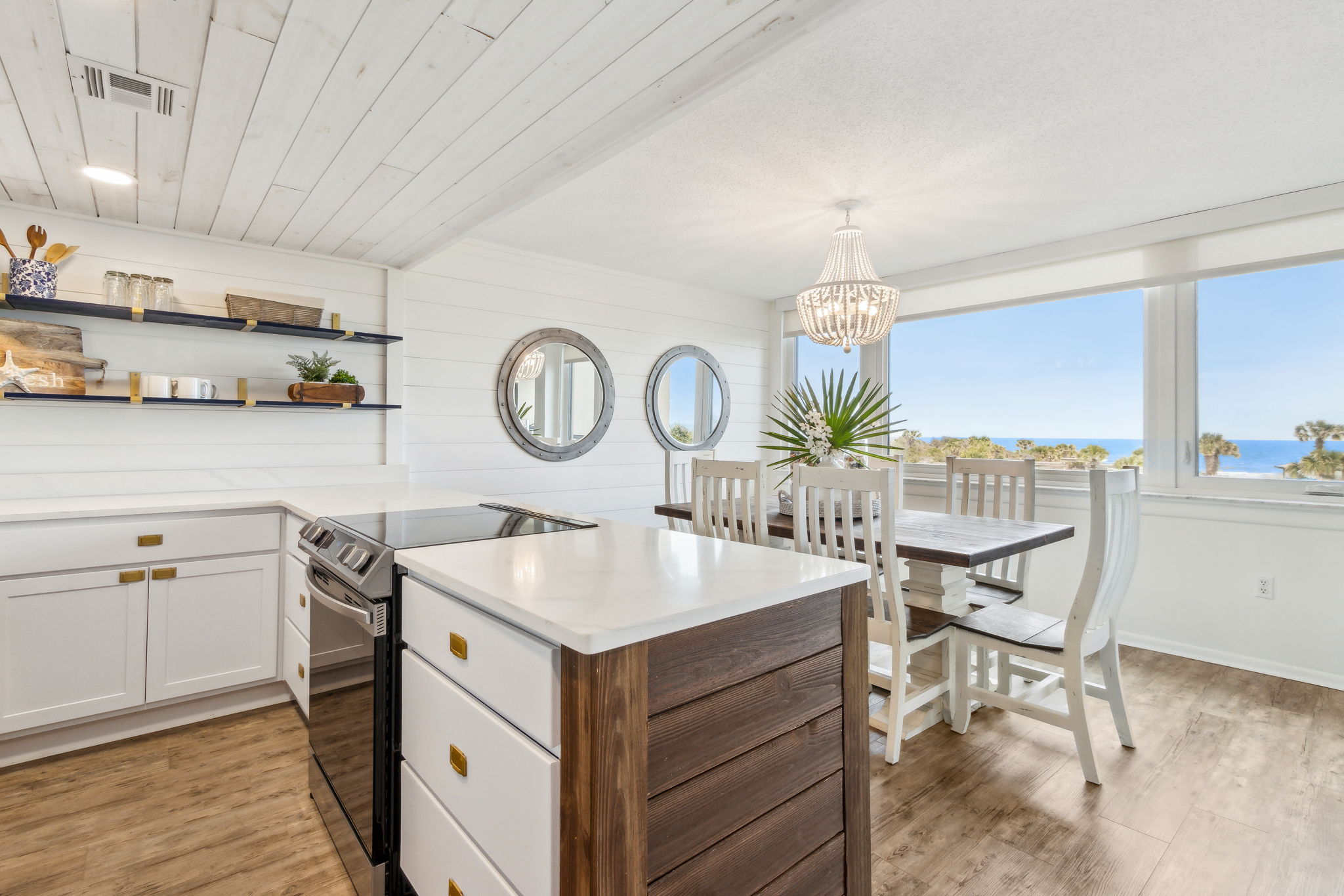 The kitchen blends luxury with coastal charm ...