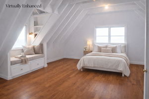 Unfinished 3rd floor RE IMAGINED VIRTUALLY  w/bedroom area and window seat. .  3rd level adds 1,334+/- SF to main home (not included currently)