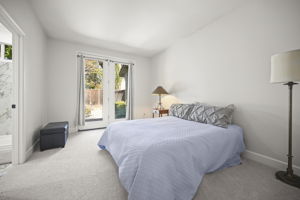 downstairs bedroom with en suite and door to rose garden