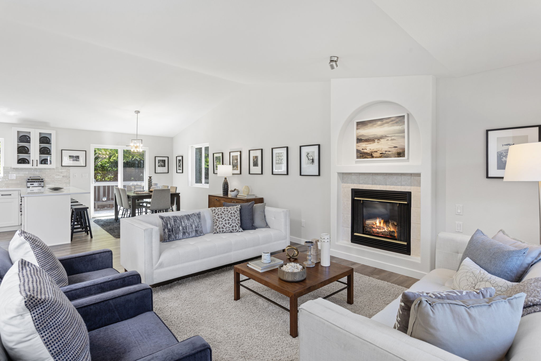 Open concept connects the living room to the dining area and updated kitchen for effortless flow.