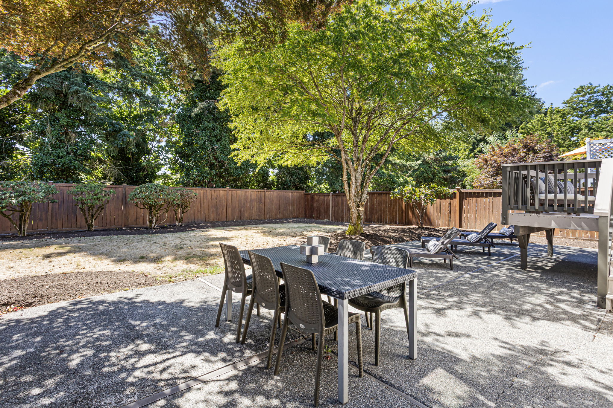 Spacious patio below provides plenty of room for alfresco dining or lounging.