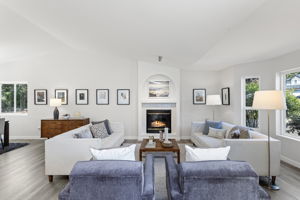 Seating area centers around the gas fireplace, creating a warm and inviting gathering space.