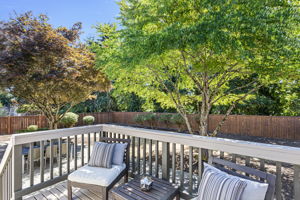 Sunny deck just off the dining room offers a seamless indoor-outdoor connection.
