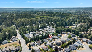 A peaceful neighborhood setting, surrounded by mature evergreens and Pacific Northwest beauty.