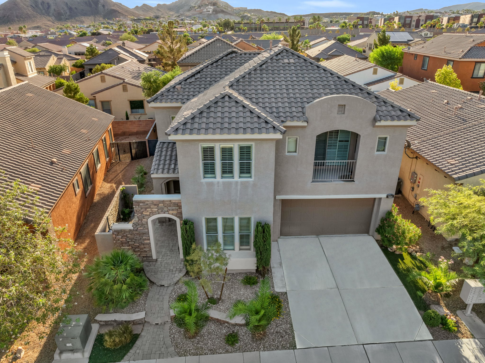 Enclosed Extensive Stone Custom Entry 3 car tandem garage