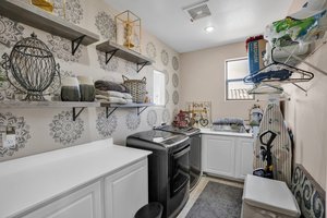 Oversized extended Laundry Room & custom cabinetry, Gas Dryer & Washer included with Full Price Offer!