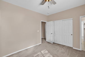 Extensive space with 3 closet door with raised panels