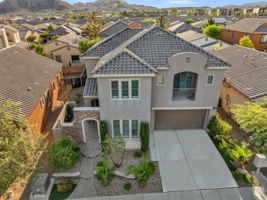 Enclosed Extensive Stone Custom Entry 3 car tandem garage