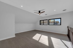 Loft/Family Room with Ceiling Fan and Windows