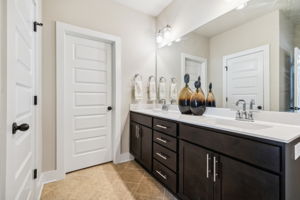 Diagonal tiles, double vanities w/2 separate walk in closets, water closet