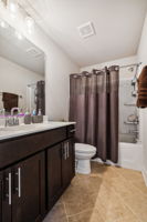 Brick laid tile in upstairs hall bath